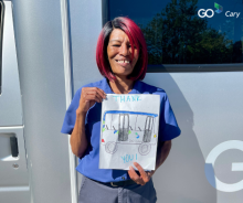 Bus Driver Holding a Thank You Drawing